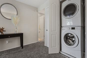 a small laundry room with a washer and dryer Kenilworth at Charles, Towson MD