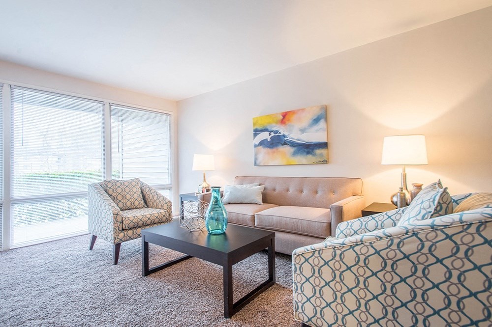 Light filled living room at Brook View Apartments, Baltimore, MD, 21209