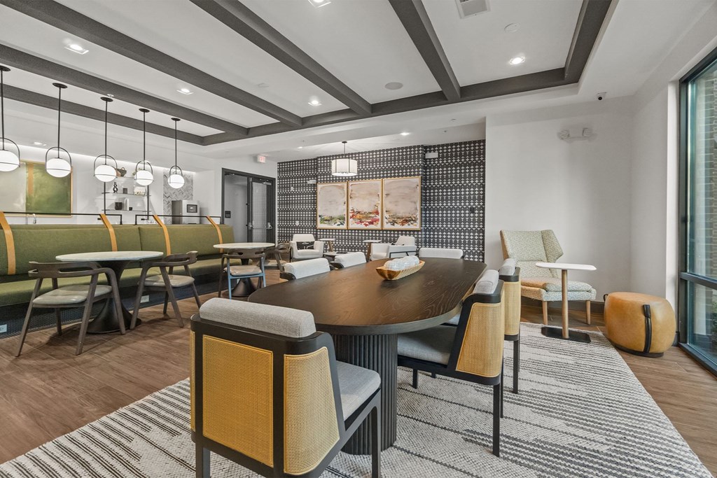 A modern clubroom with a large table and chairs. at 1010 Dilworth Apartments, Charlotte