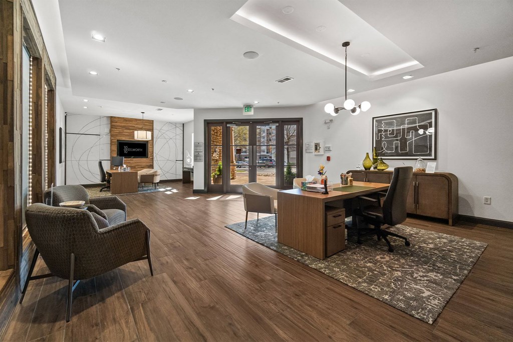 A modern office with wood floors and furniture at 1010 Dilworth Apartments, North Carolina