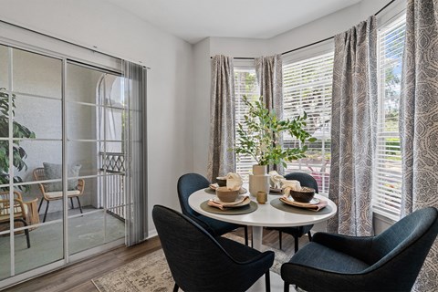 Breakfast nook with round table and sliding door to patio at Henley Tampa Palms Apartments, Florida, 33647