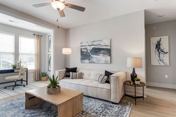 a living room with a couch and a ceiling fan at Bristol at New Riverside, South Carolina, 29910