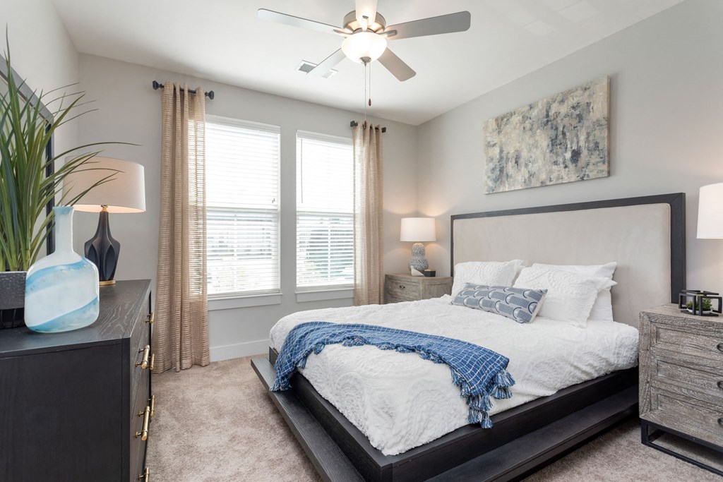 a bedroom with a large bed and a ceiling fan a bedroom with a large bed and a ceiling fan at Bristol at New Riverside, Bluffton, SC 29910