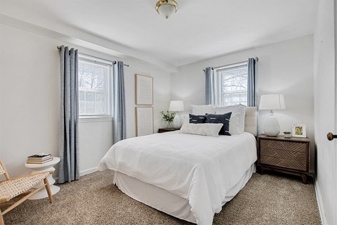 Bedroom with two windows at Cross Country Manor Apartments, Baltimore, 21215