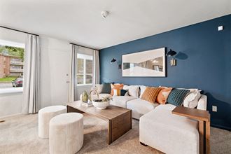 a living room with blue walls and a white couch
