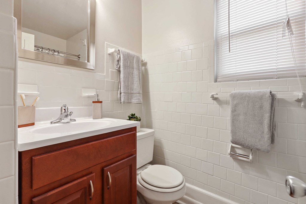 Light filled bath room with cabinet vanity at Donnybrook Apartments, Towson