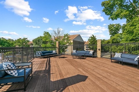 spacious deck with furniture and privacy fence at McDonogh Township Apartments, Owings Mills