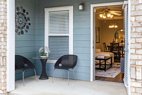Private patio with seating at Carolina Point Apartments, Greenville, SC, 29607