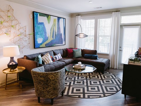 Living room with patio door at Sycamore at Tyvola, Charlotte, NC