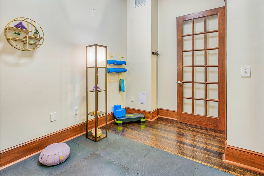 A room with a wooden floor and a wooden door at The Lofts at Reynolds Village Apartments, Asheville, NC