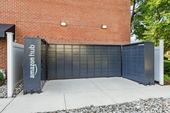 amazon hub package lockers in front of a brick building at Courthouse Square Apartments, Towson, 21286