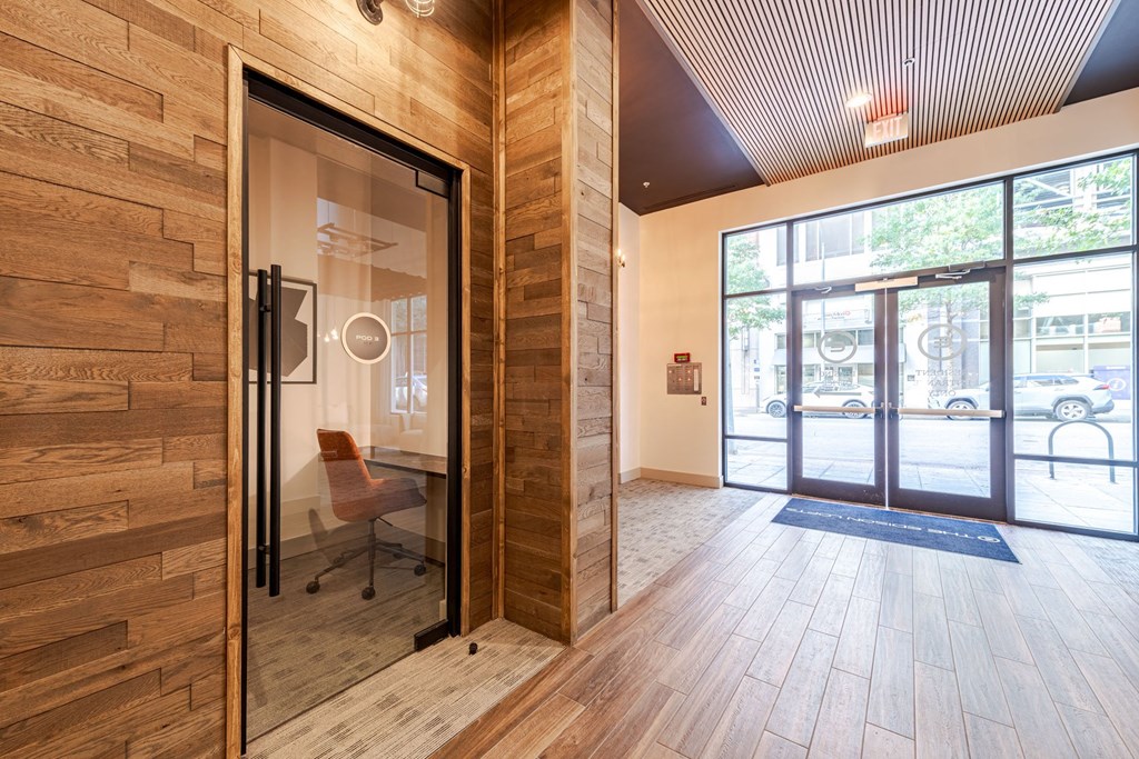 A room with a glass door and a wooden wall at The Edison Lofts Apartments, Raleigh, North Carolina