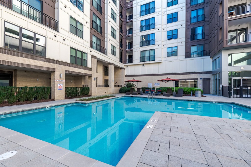 A large swimming pool in front of apartment buildings at The Edison Lofts Apartments, Raleigh, NC, 27601