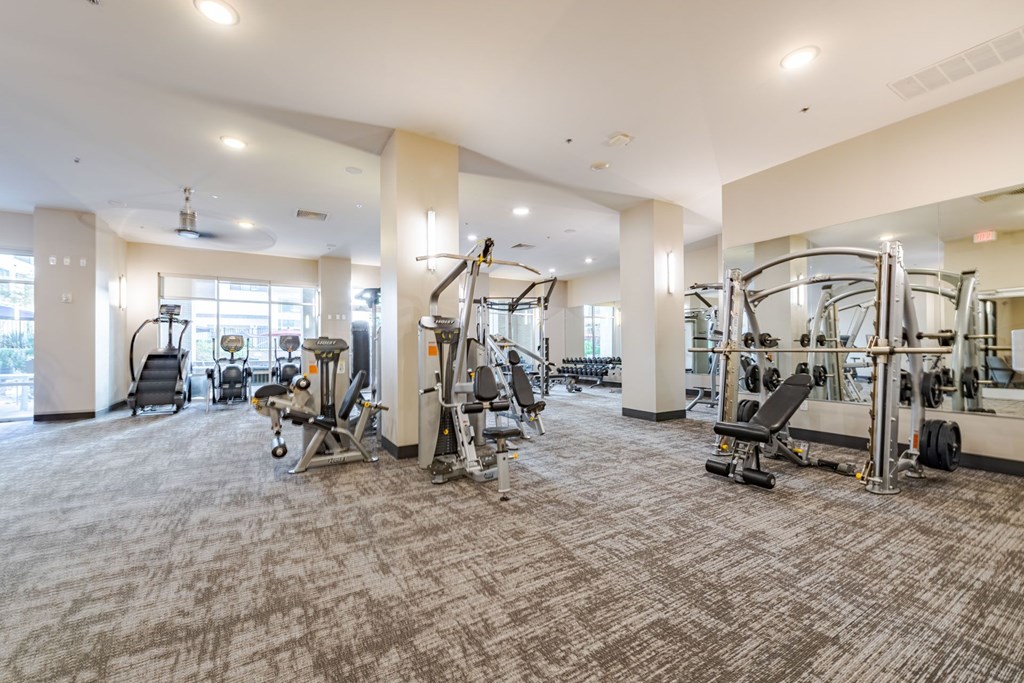A spacious gym with a variety of equipment at The Edison Lofts Apartments, Raleigh, North Carolina