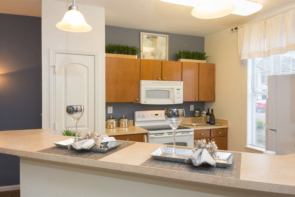 a kitchen with a large island with a breakfast bar at Fortress Grove, Murfreesboro, TN
