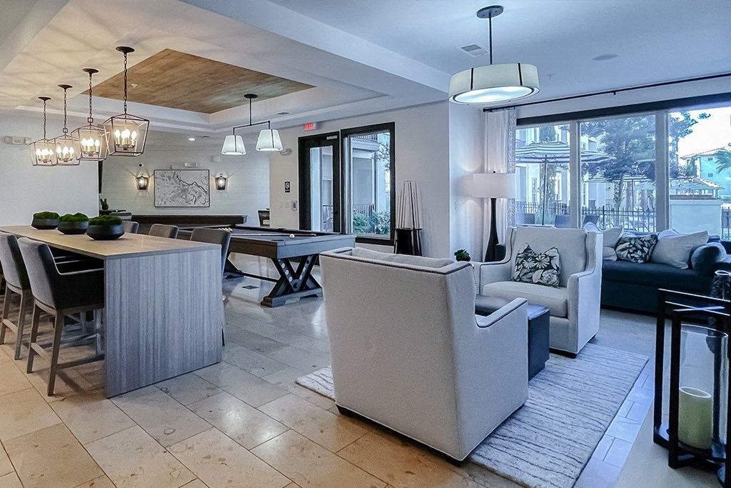 Resident lounge seating areas and large windows  at Two Addison Place Apartments , Georgia