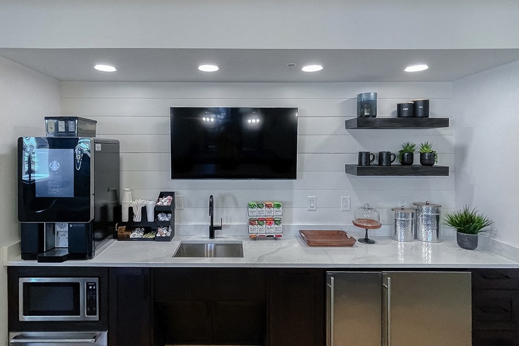 Coffee bar in the resident lounge  at Two Addison Place Apartments , Pooler, GA, 31322
