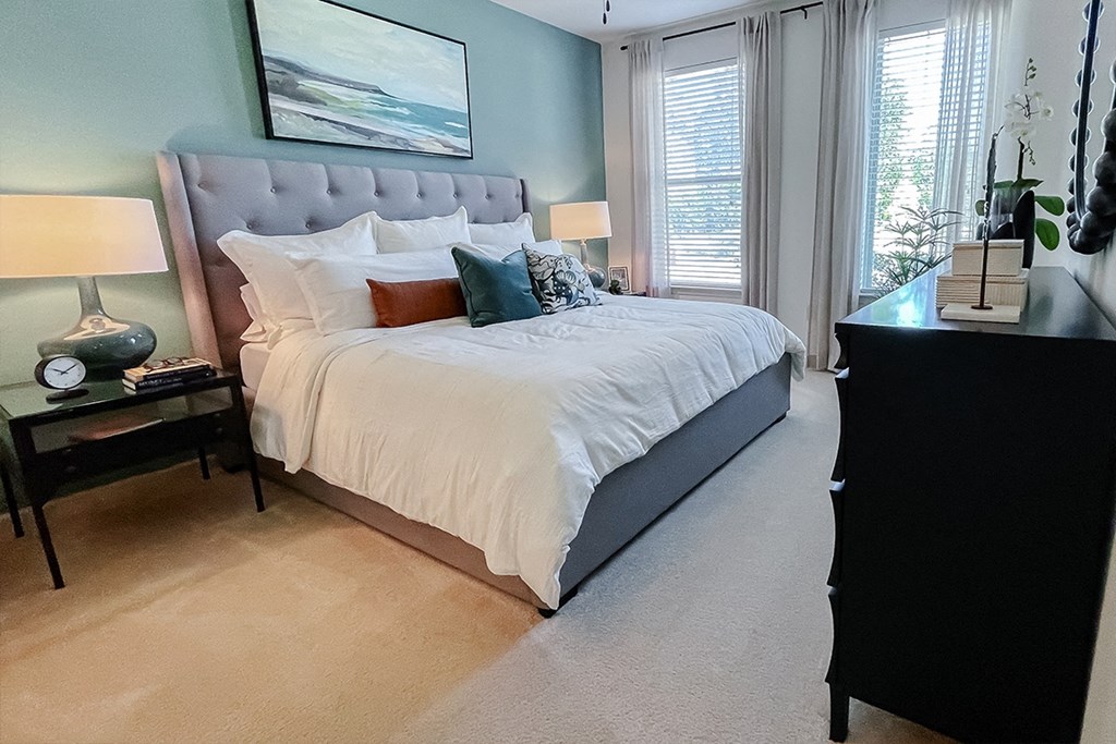 Model bedroom with large bed and lots of light  at Two Addison Place Apartments , Georgia