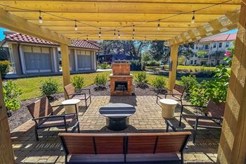 Outdoor fireplace lounge at Two Addison Place Apartments , Pooler, 31322