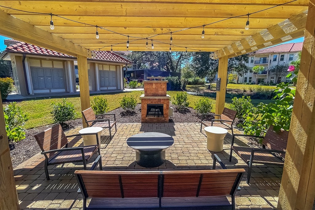 Outdoor fireplace lounge at Two Addison Place Apartments , Pooler, GA