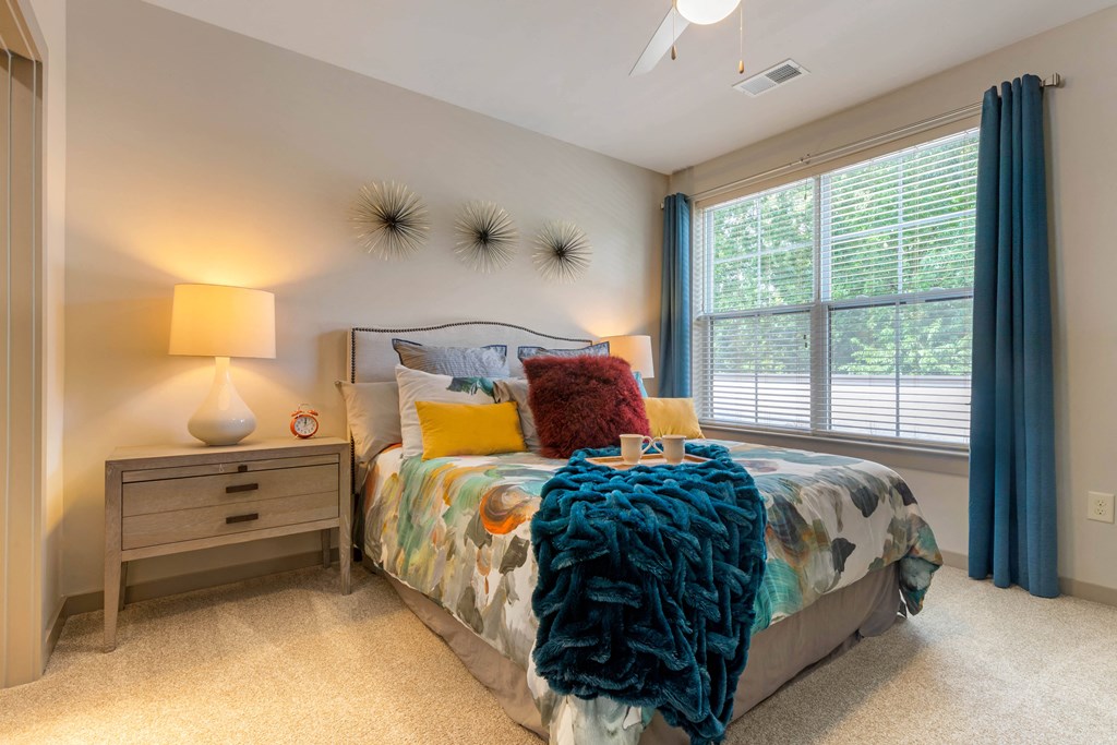 Bedroom with bed and nighstand at 1010 Dilworth Apartments, Charlotte, 28204