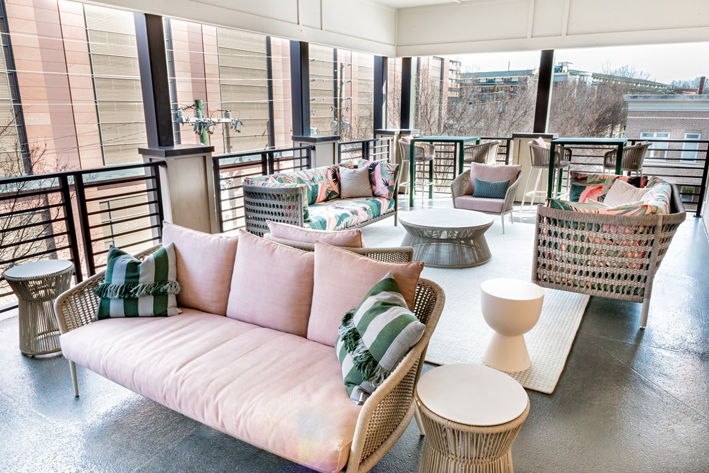 a rooftop seating area with couches and tables at Park and Kingston, Charlotte, NC, 28203