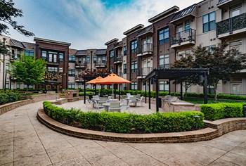 Beautiful Landscaping and Seating Area Beautiful Landscaping and Seating Area at Park & Kingston Apartments, Charlotte, NC 28203 - Photo Gallery 5