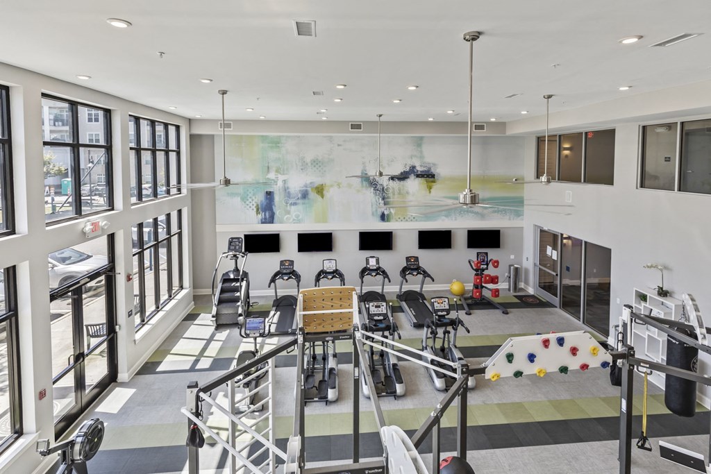 the lobby of a gym with chairs and a large wall of windows at Central Island Square, Daniel Island, South Carolina