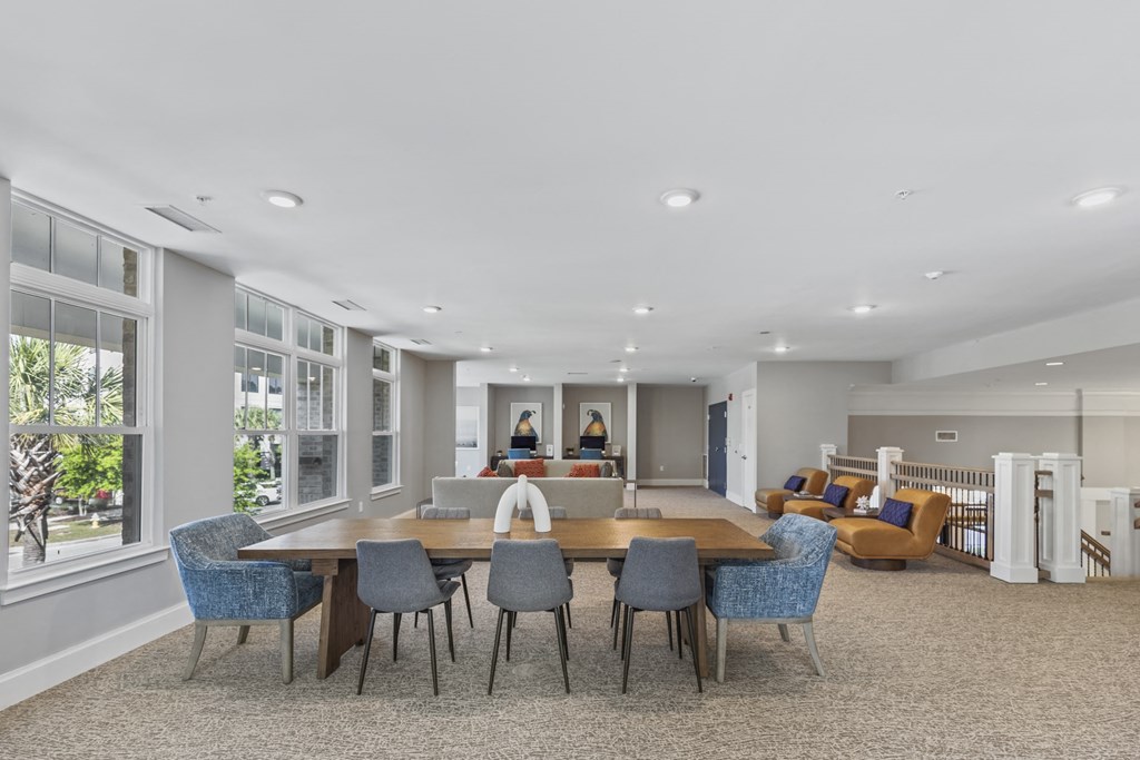 resident lounge with a large table and chairs at Central Island Square, Daniel Island, 29492