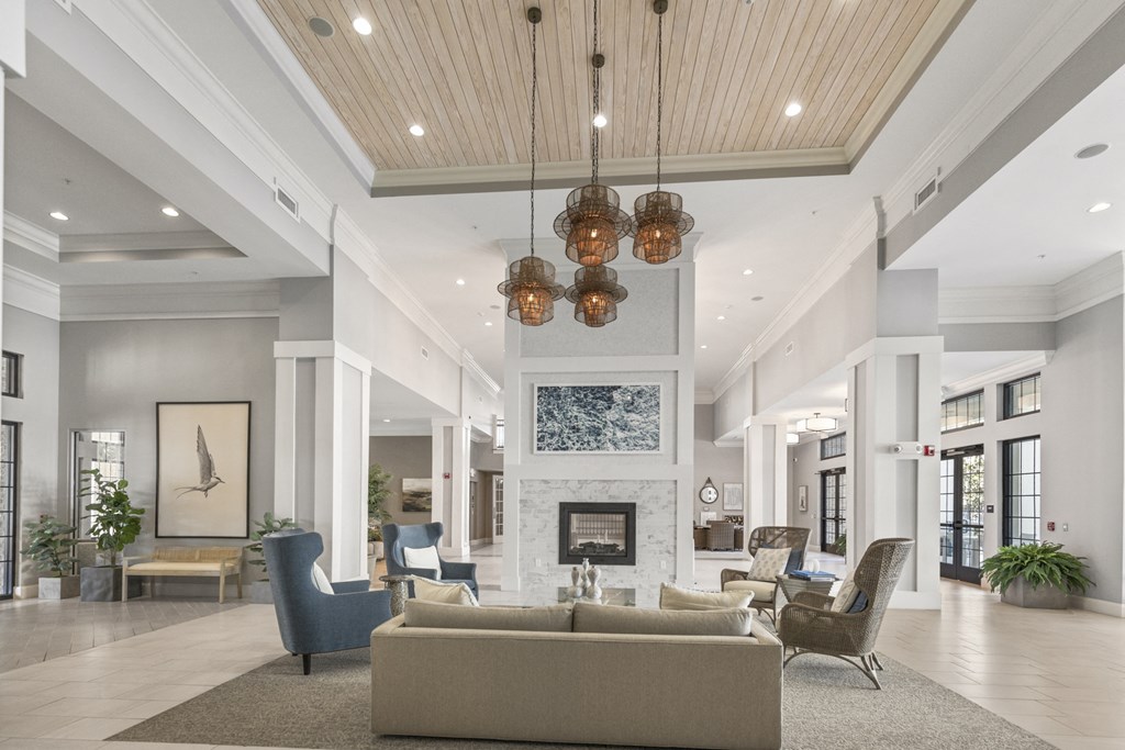a lobby with couches and chairs and a fireplace at Central Island Square, Daniel Island, 29492
