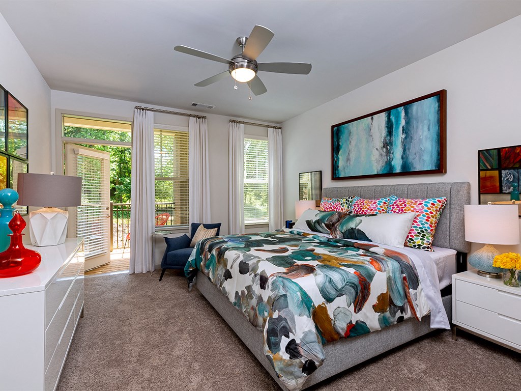 Bedroom with private patio access at Sycamore at Tyvola, Charlotte, North Carolina