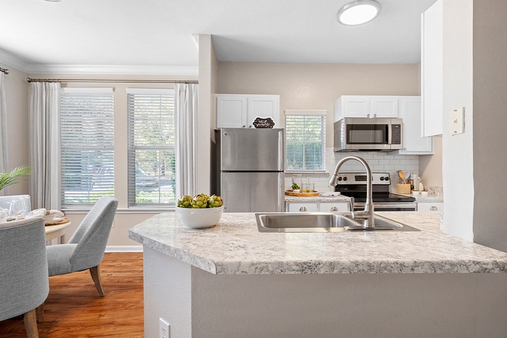 a kitchen with a granite counter top and a sink at Sweetgrass Landing, Mount Pleasant, 29466