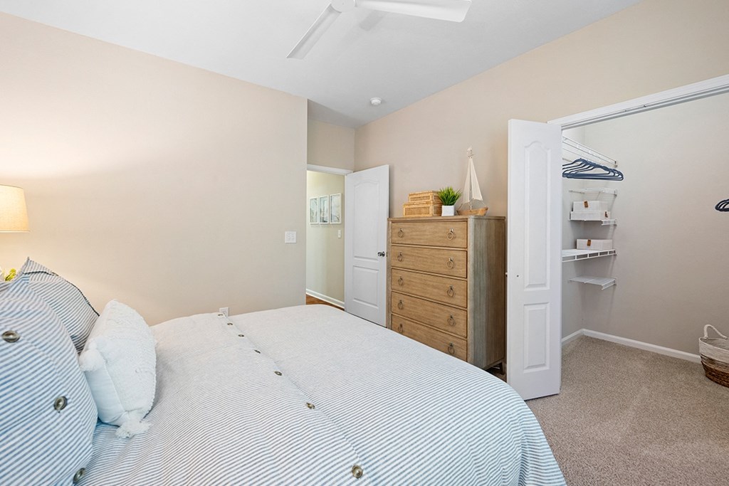 a bedroom with a bed and a closet at Sweetgrass Landing, South Carolina, 29466