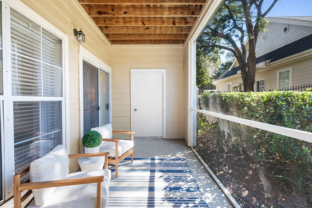patio two chairs and a white door at Sweetgrass Landing, Mount Pleasant, 29466