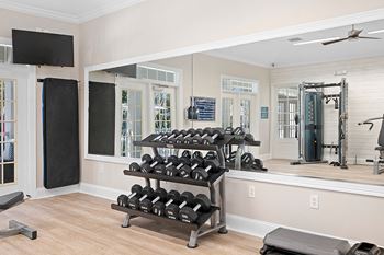 the residence on lamar apartment homes fitness room with weights and mirrors at Sweetgrass Landing, Mount Pleasant, 29466