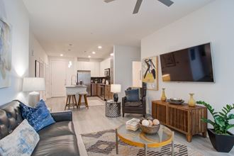 Open Kitchen and Living Room Open Kitchen and Living Room at Millworks Apartments, Atlanta, GA, 30318 - Photo Gallery