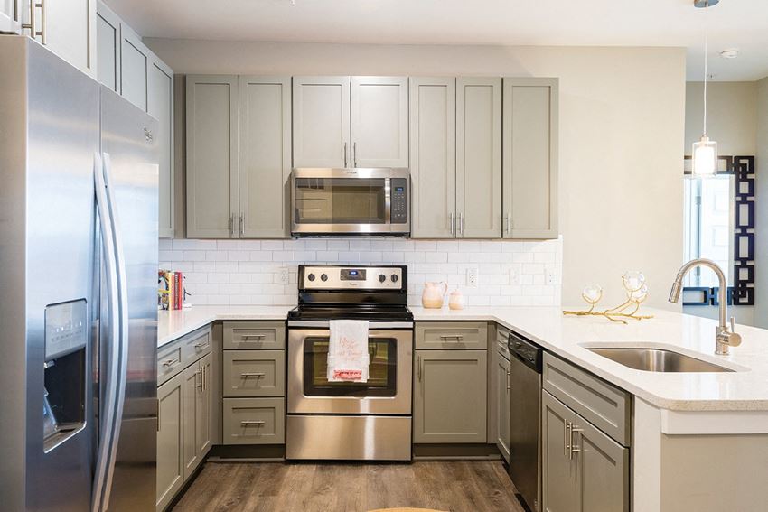Kitchen with Stainless Steel Appliances Kitchen with Stainless Steel Appliances at Central Island Square, Daniel Island