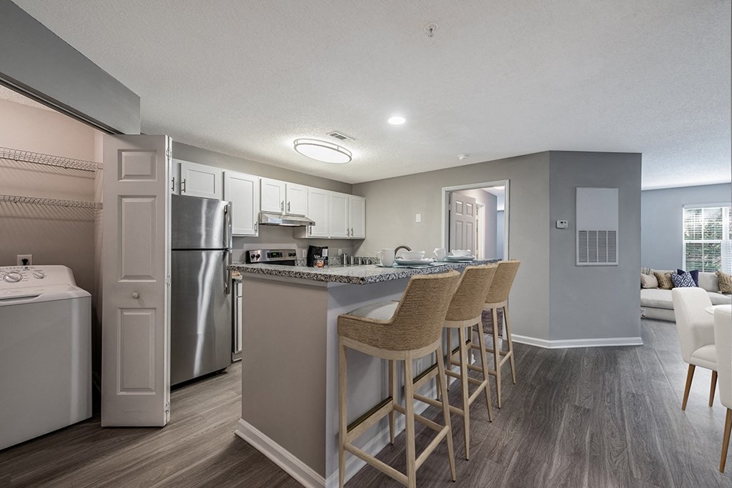 kitchen and bar with stools  at The Village Apartments, Raleigh, 27615