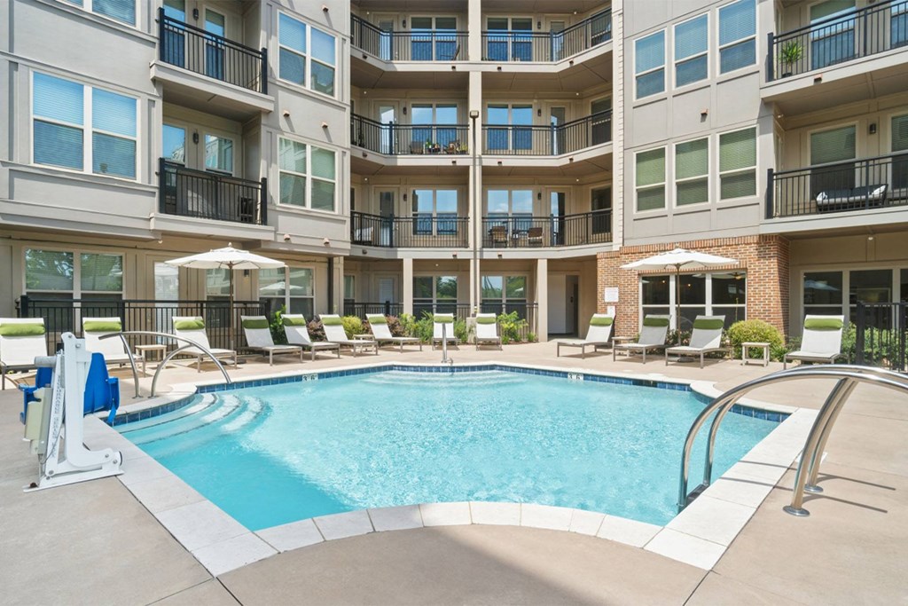 A large swimming pool in front of apartment buildings at The Linden Apartments, Davidson