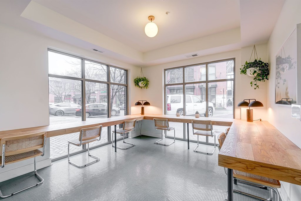 A room with a long table and chairs at The Linden Apartments, Davidson, 28036