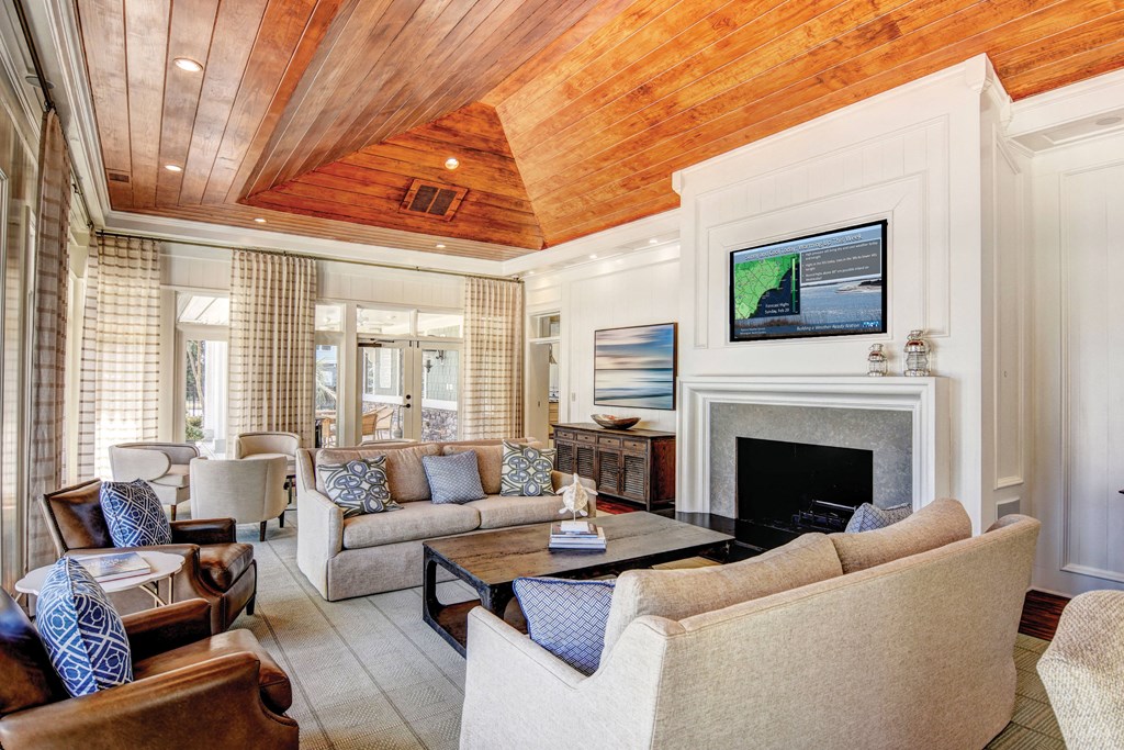 Clubhouse fireplace seating at The Reserve at Mayfaire Apartments, North Carolina