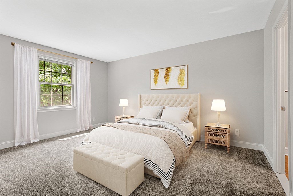a bedroom with gray walls and a large window  at Courthouse Square Apartments, Maryland, 21286