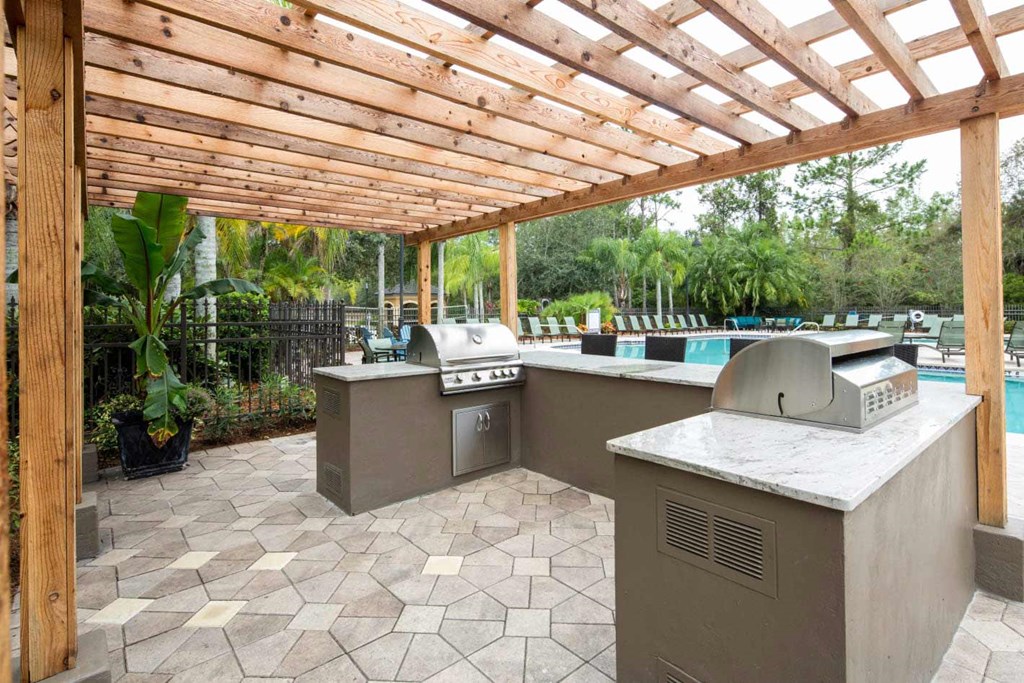 Outdoor Kitchen Area at The Grand Reserve at Tampa Palms Apartments, Florida