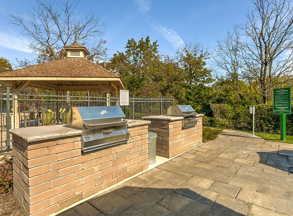 Outdoor grilling area  at Falls Village Apartments, Baltimore, 21209