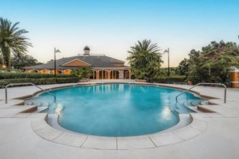 a large swimming pool with pool house in the background, Henley Tampa Palms, Tampa, FL