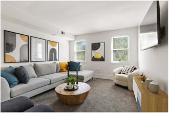 Living room with ample lighting  at Donnybrook Apartments, Towson, Maryland