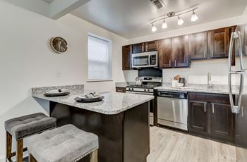 Kitchen with Breakfast Bar at Perring Park Apartments, Parkville, 21234