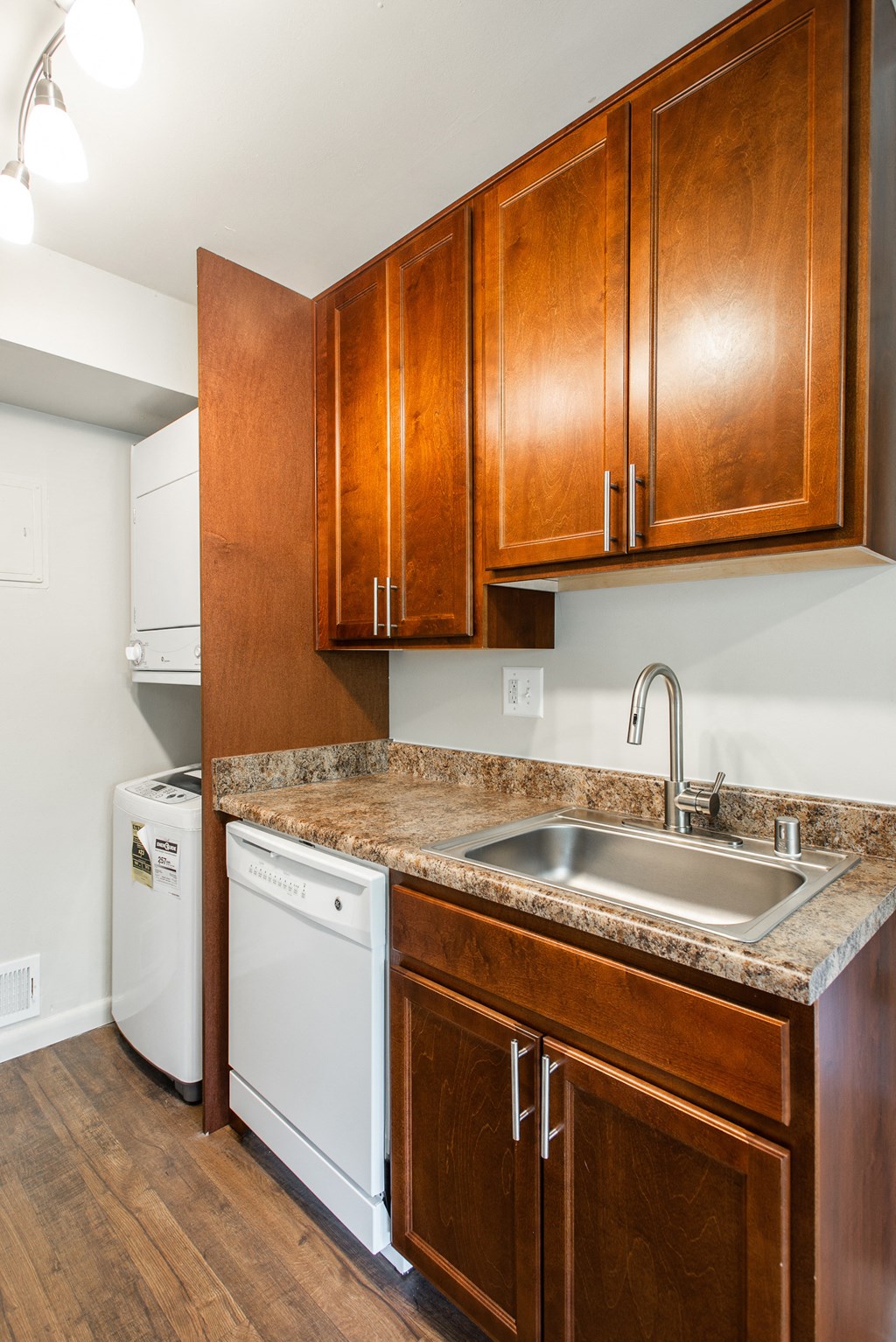 Kitchen area with washer and dryer and dishwasher  at Falls Village Apartments, Baltimore, MD, 21209
