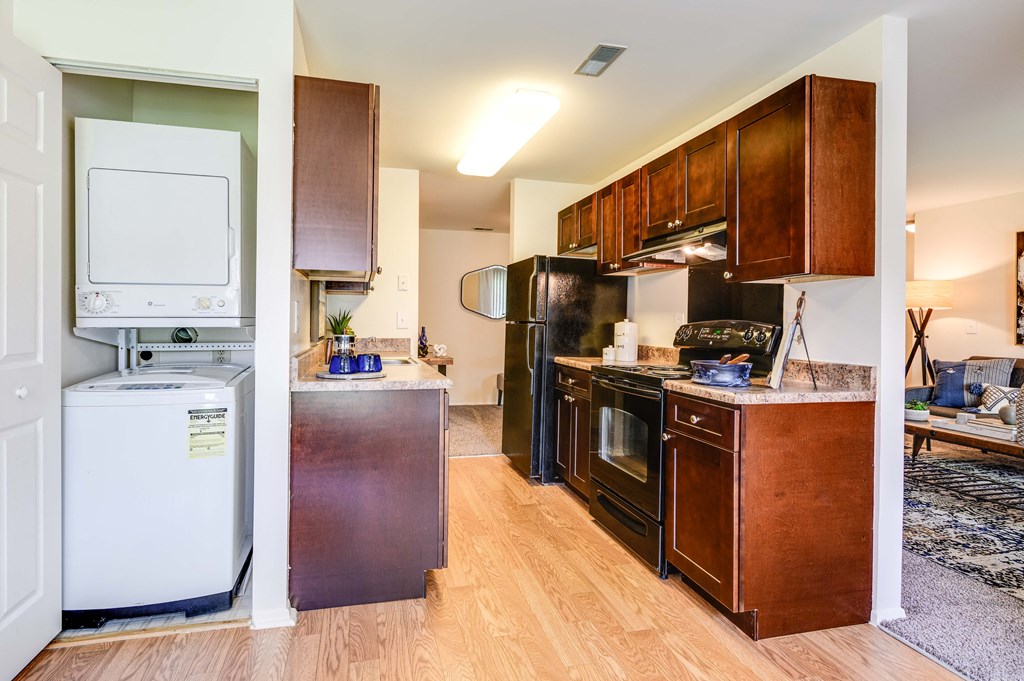 Washer And Dryer Attached Along With Kitchen Area at Westwinds Apartments, Annapolis, Maryland