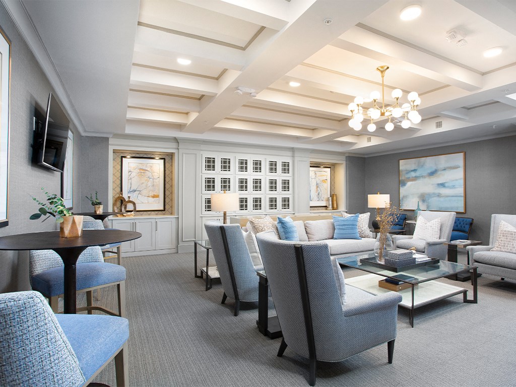Resident lounge with tables and chairs  at St Mary's Square North Apartments, North Carolina, 27605